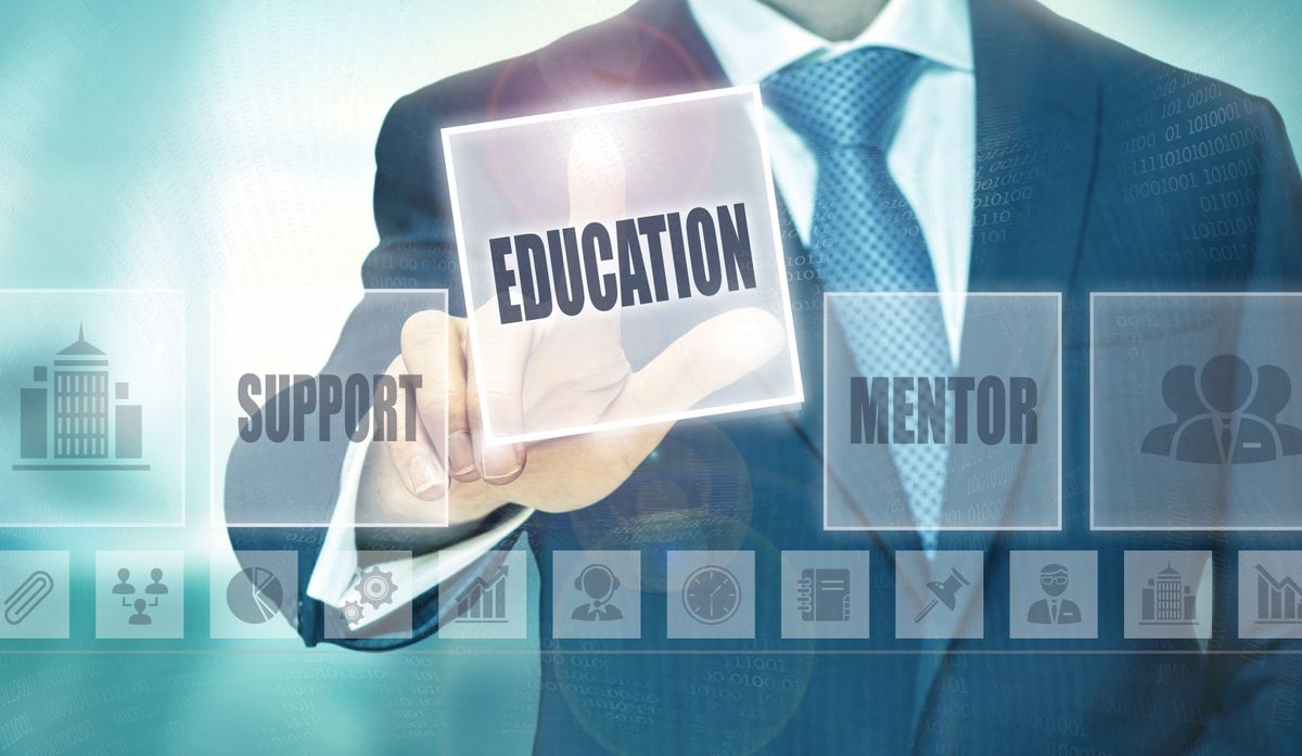 Businessman pressing an Education concept button. Businessman pressing an Education concept button.